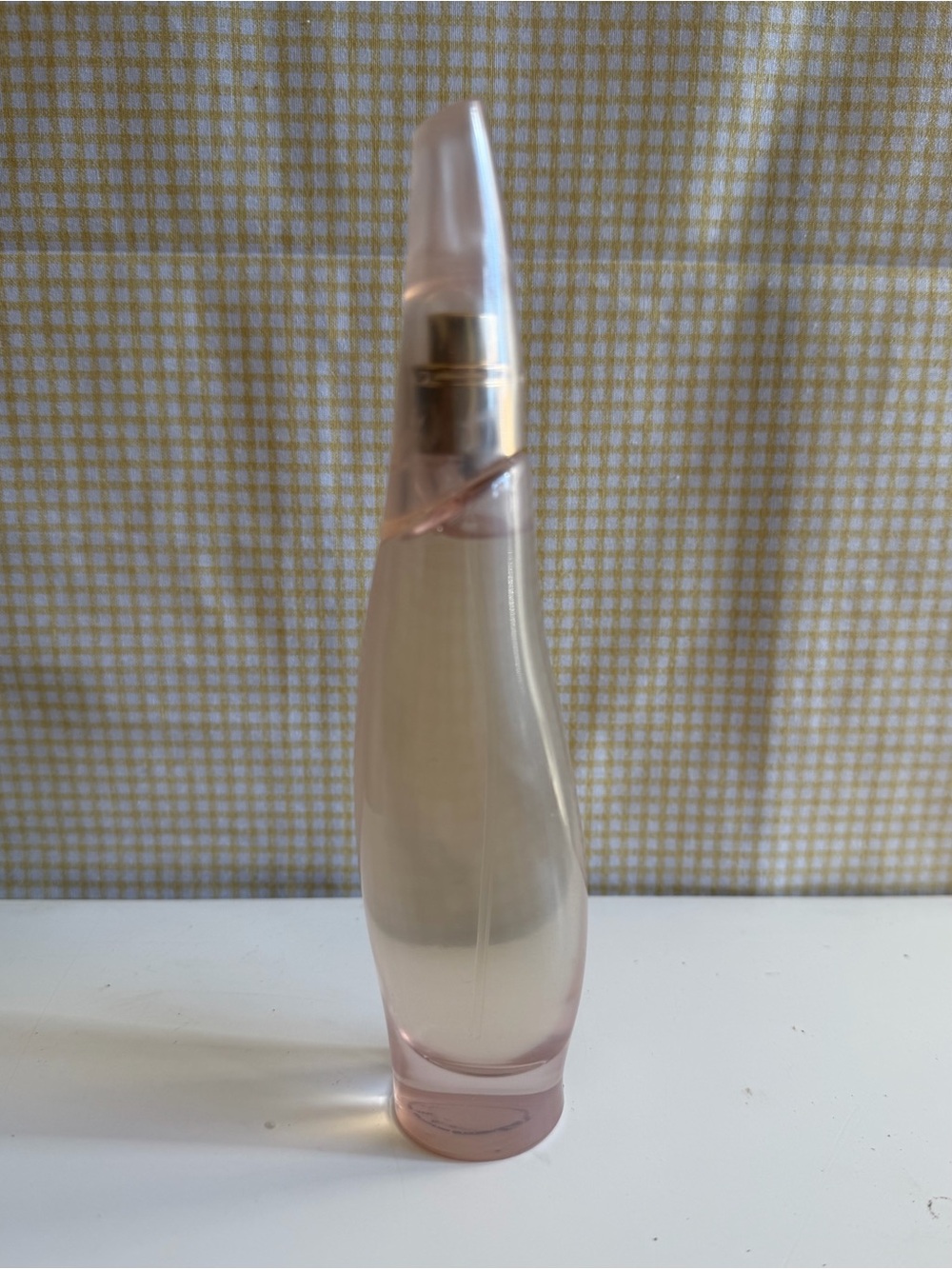 Donna Karan Pink and Gold Curved Serum Bottle